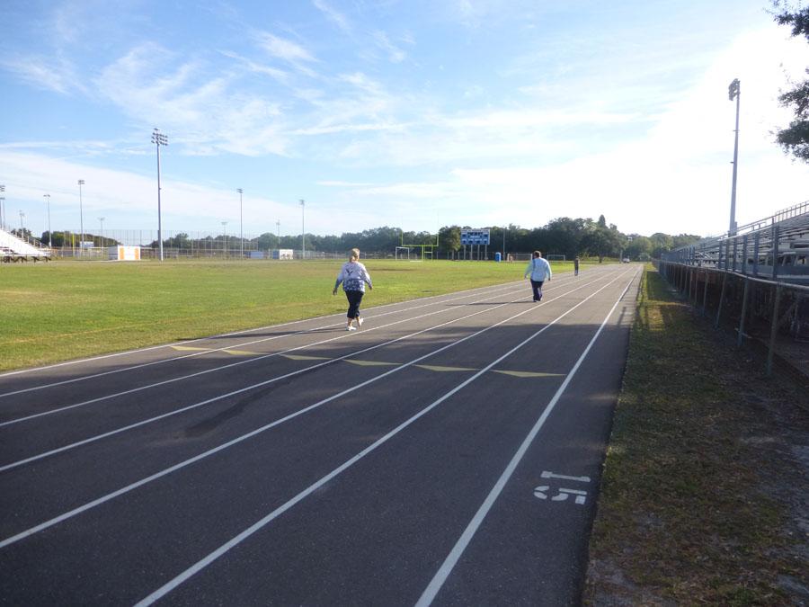 Students walk around the track during 3rd period.  Many students say when they lose sleep, they lose focus in class.