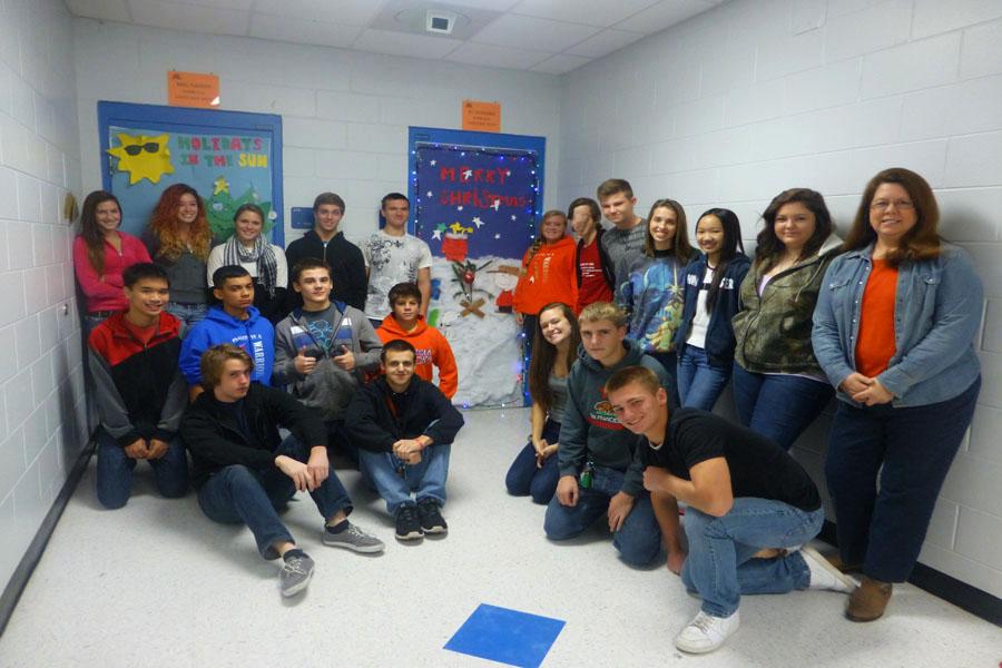 Mrs. Eubanks' first period proudly stand infront of their winning door.