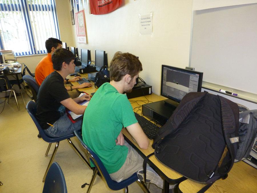 One of the groups that the prep rally will be recognizing is the robotics class. This class is shown above working on computers. 