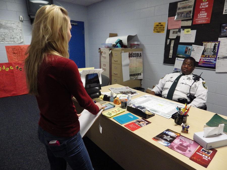 Staff writer Shianne Auriemma talks to Deputy Shorter about the quiet days at Osceola.