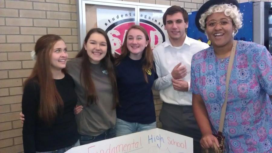 The show must go on... Actors from the play "Done to Death" answer questions about the drama department at Saturday's high school fair.  