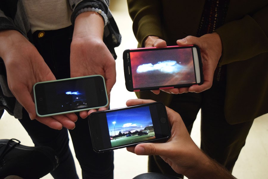 Students display multiple pictures of the sky.