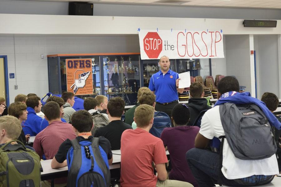 New Head Coach Kevin Smalley speaks to students interested in playing football after school Thursday.