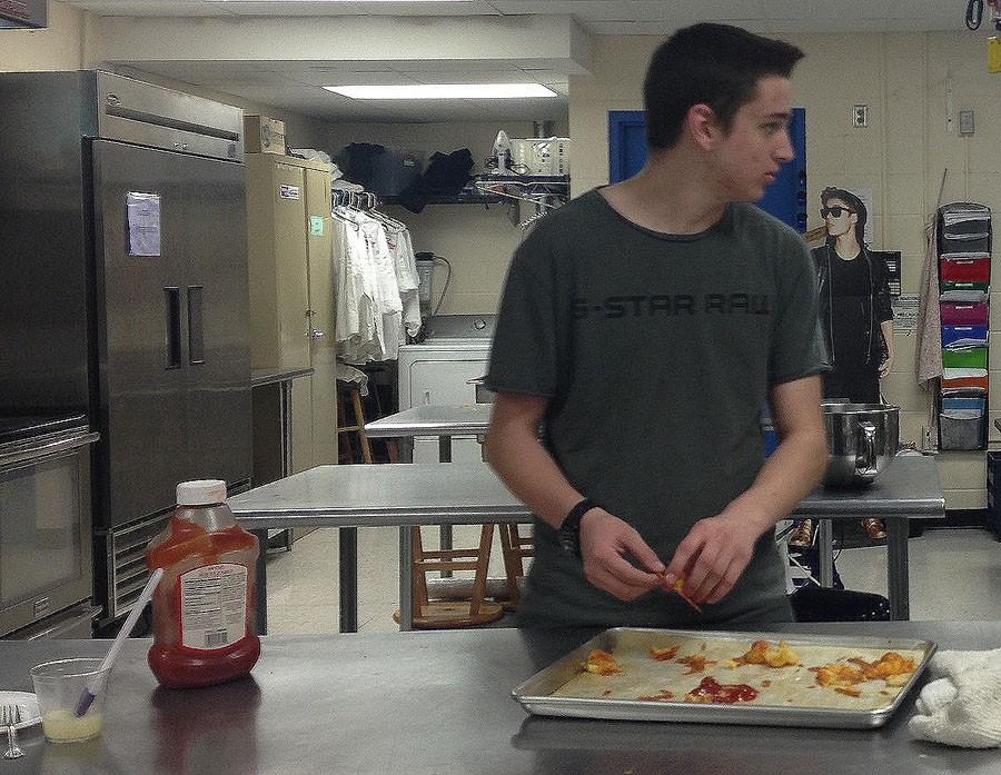 Ryan Bond helps prepare Duchess potatoes for the inaugural Literary Dinner on February 29th, 2016. 