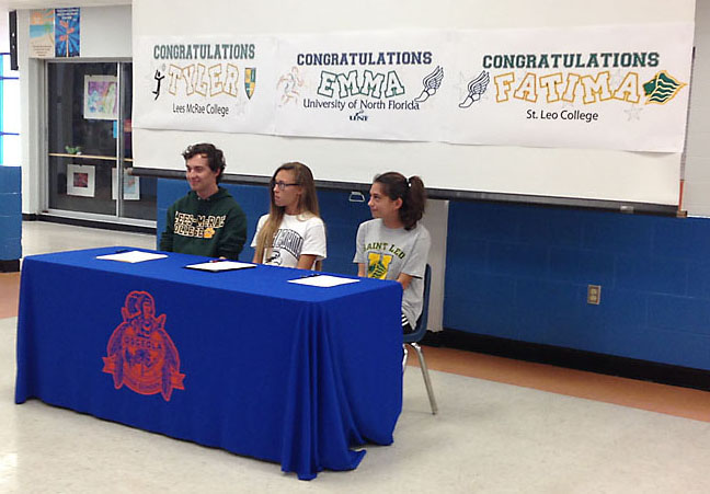 Tyler Doyle, Emma Grantges and Fatima Abu-Rumman prepare to sign with three different colleges.