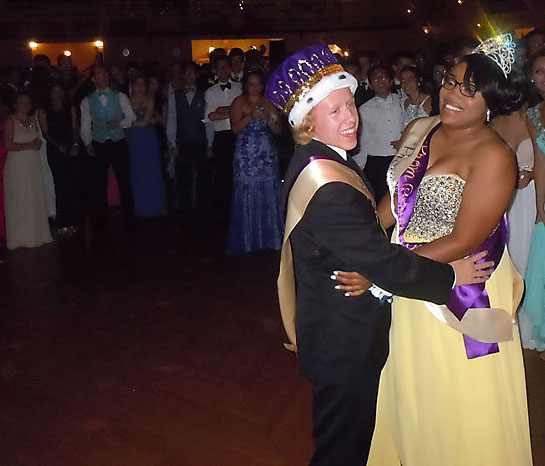 Jamiia Spradley, right, and Wesley Morgan, left, take part in the traditional king and queen dance.