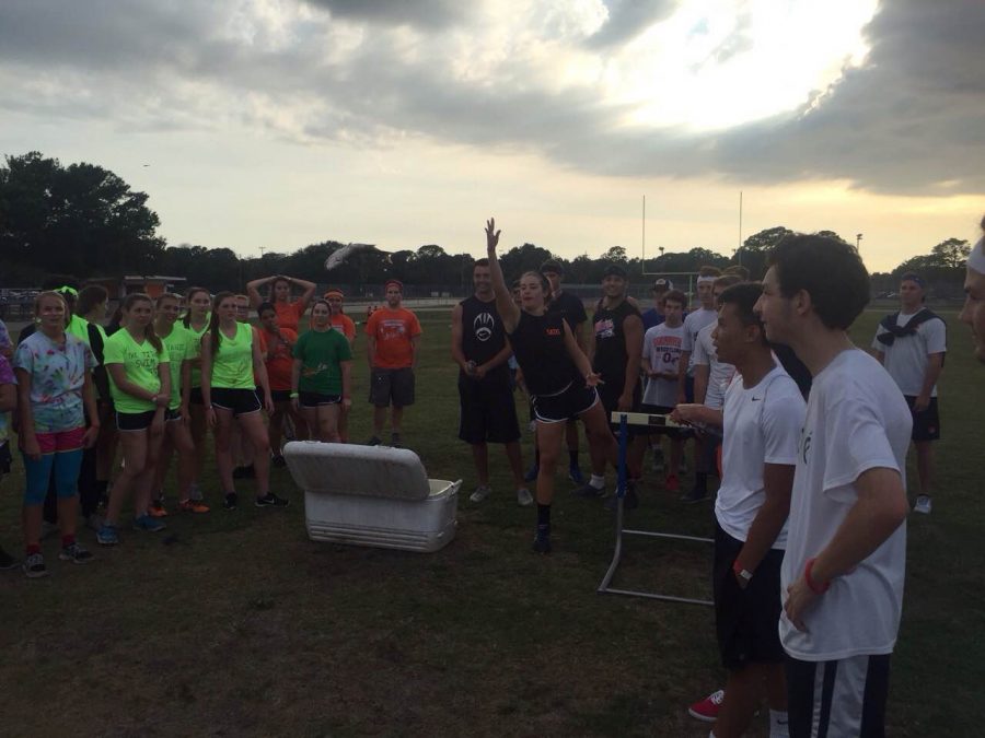 Students partake in the fish throwing contest, one of the many activities at the senior Olympics. 