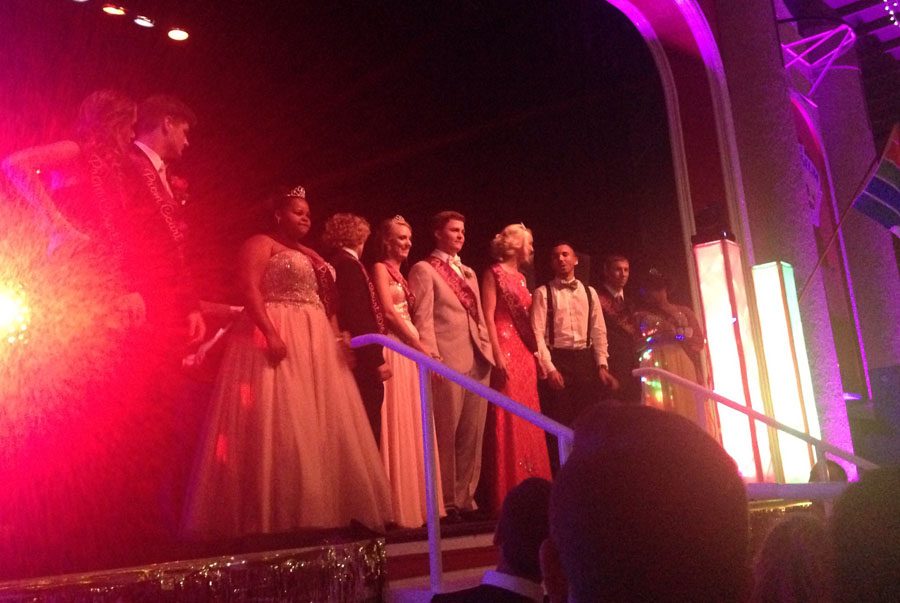 Jamiia Spradley, right and Wesley Morgan, left take part in the traditional king and queen dance.