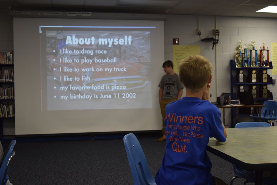 A student presents his Haiku Deck for Warrior Academy. 