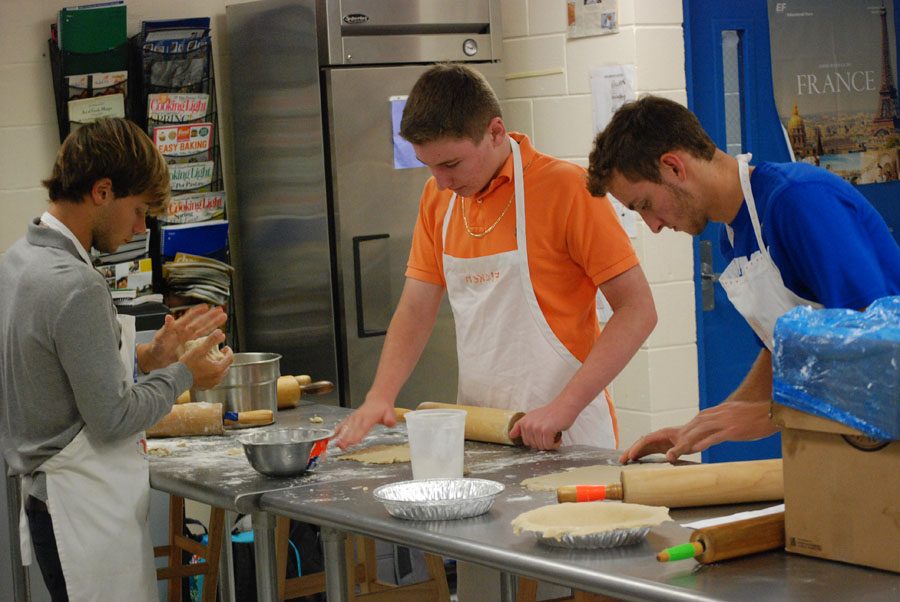 Ruslan Cidwell, 10th grade, Zane Ficken, 11th grade, and Garrett Cook, 12th grade have started to make the pie crust. 