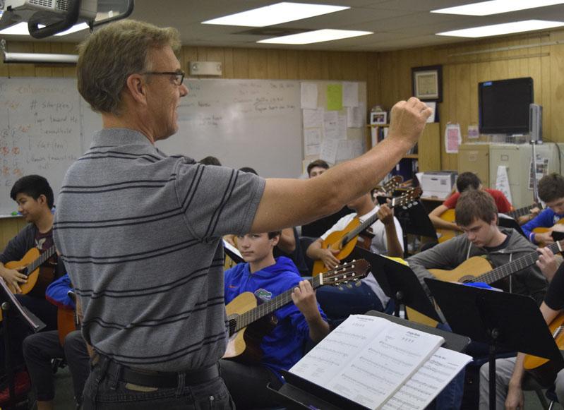 Mr. Campbell rehearses with his students for the concert.