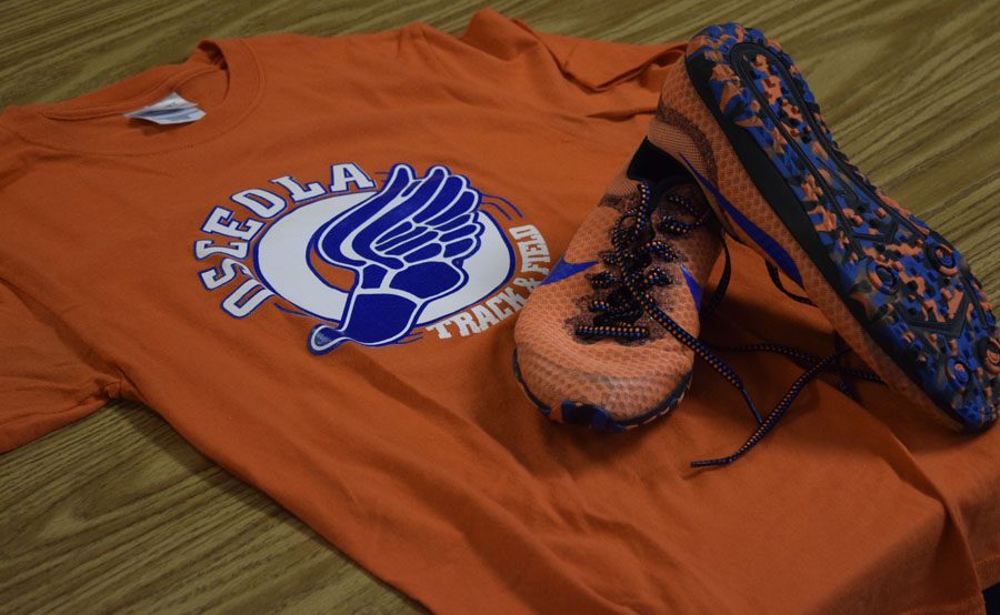 This is just some of the clothing that track students can wear from the orange and blue racing flats on race day to the old track logo shirt for school.