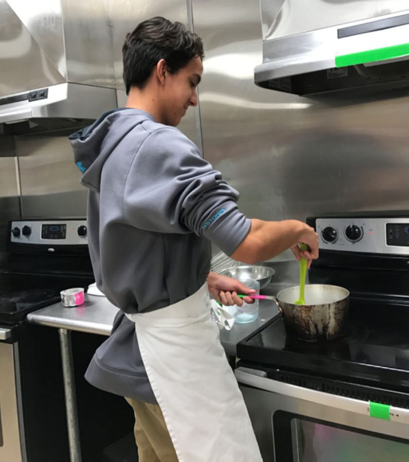 Blue Bailey prepares a meal in culinary.