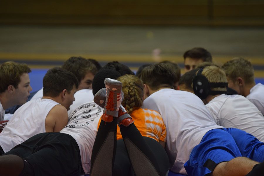 The Warrior wrestling team practices now in the back of the gymnasium. 