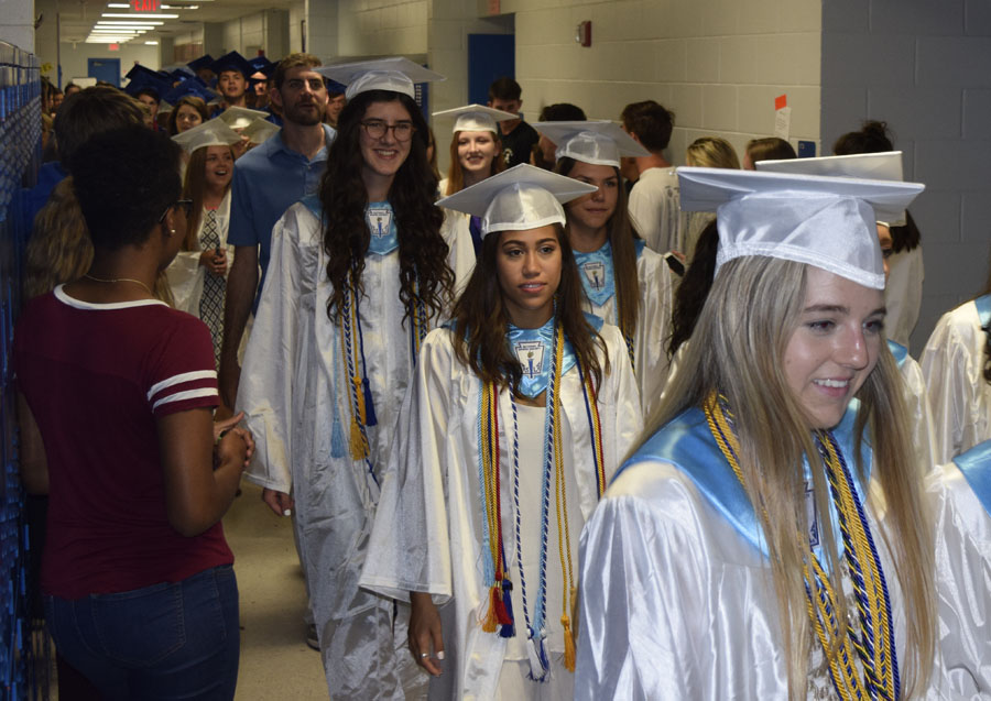 Seniors march in caps and gowns