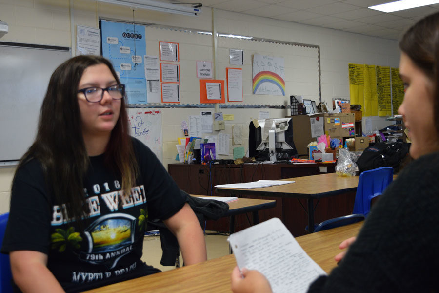 Amy Morle, grade 12, answers questions from a fellow classmate.