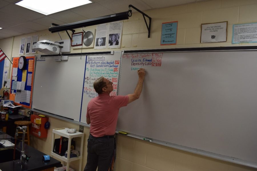 Mr. Merker works with chemistry students during second period. 