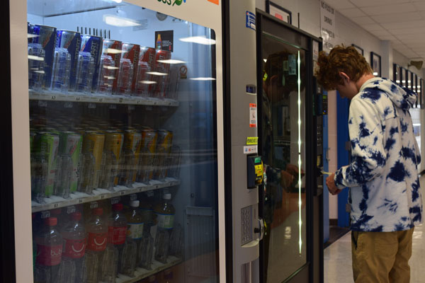 Sophomore Ethan Tuttle, buys snacks at the vending machine.