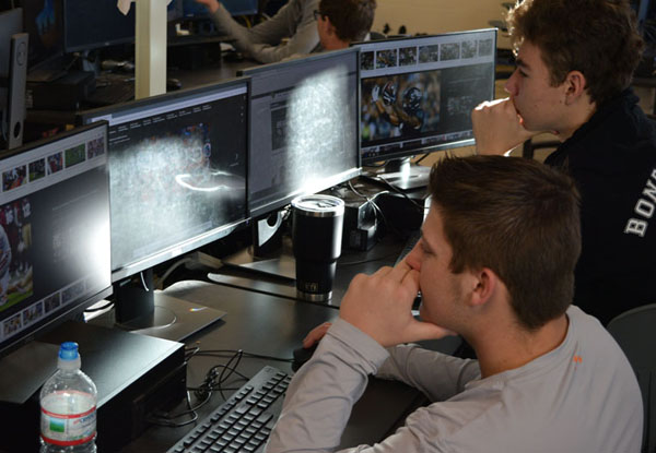 Andre and Kelton look over draft prospects.