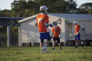 The boys lacrosse practices by the portables in 2019.