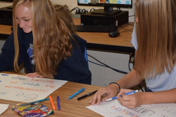 Students in third period make a poster at 9 am, when most middle schools would have just started.  Thats can be a rough transition for freshmen.