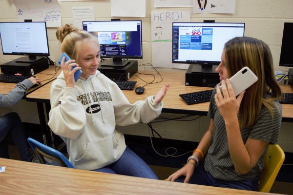 Kelli Slater, left, is very satisfied with her iPhone XR and doesn't see herself purchasing the iPhone 11 in the future.