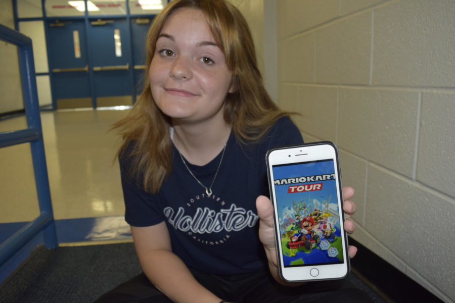 Katie Gonzales is happily playing Mario Kart.