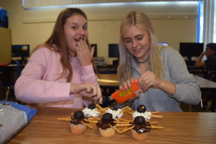 Johana Campas and Kylie Kagan creating some DIY Halloween treats.