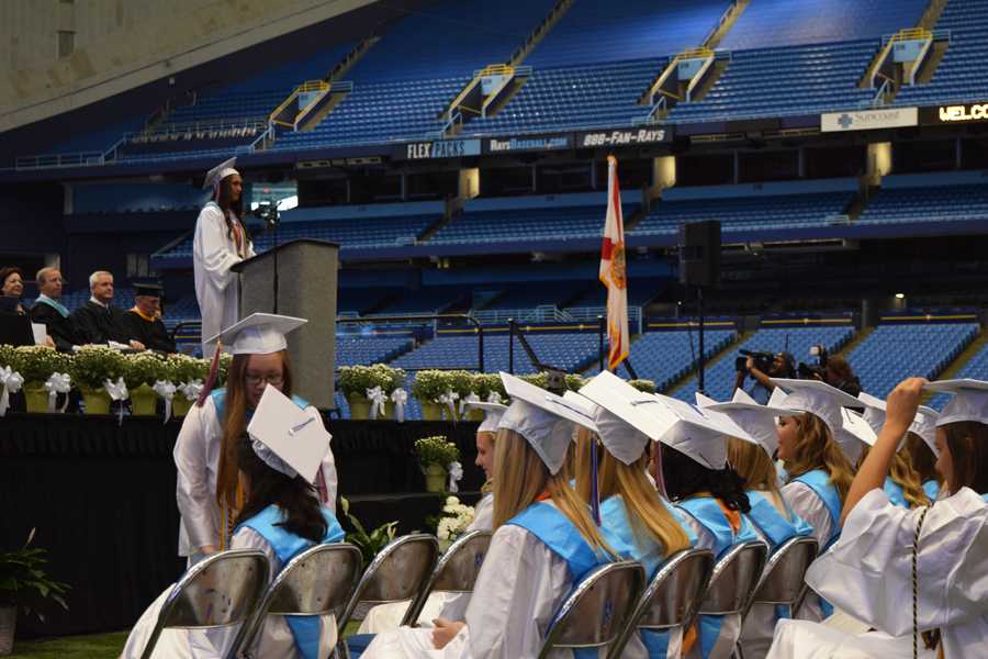 The+senior+class+president+of+2015+speaks+to+her+classmates+during+graduation.