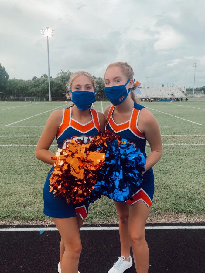 Grace and Payton still enjoy cheer despite difficulties due to Covid.