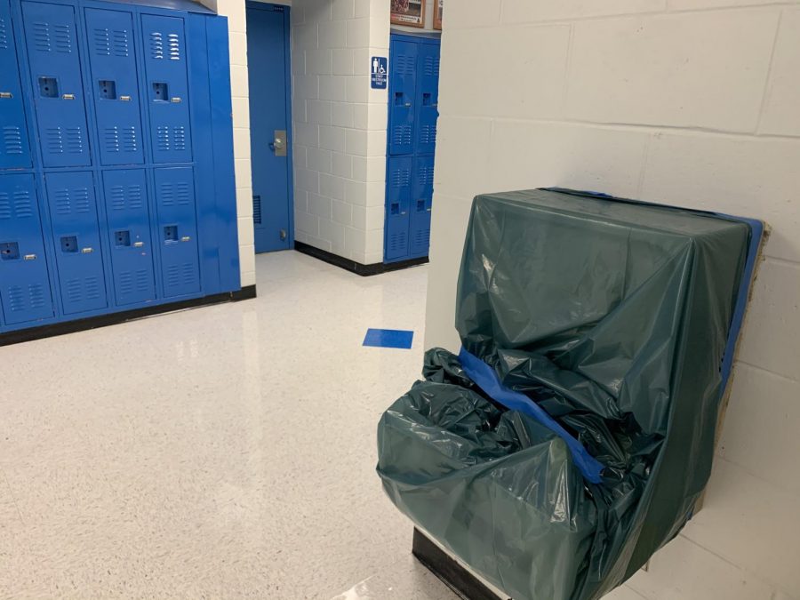 The water fountains are covered up to keep students safe from COVID.