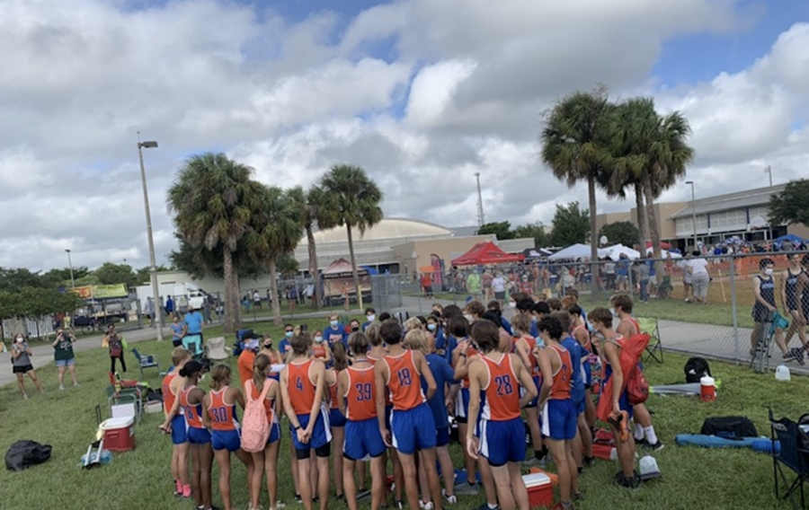 At the Northport meet, runners huddle after the races.