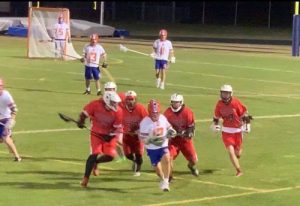 Ryan Kinnear is running down the field during a game last season against Clearwater High School at the Warriors Stadium. He's on a fast break.