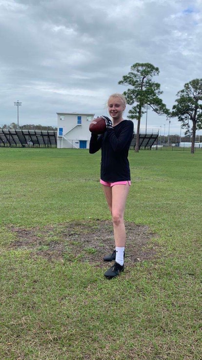 Osceola flag football player Taylor Salgado, practices her catching skills on the practice field.