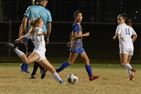 Kelli Slater, Forward, tries to score a goal against Largo High school in a game last year.
