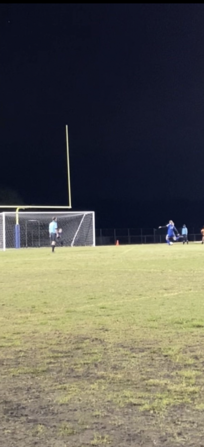 Chloe Cors kicks one of the final penalty kicks during the regional quarter final game.