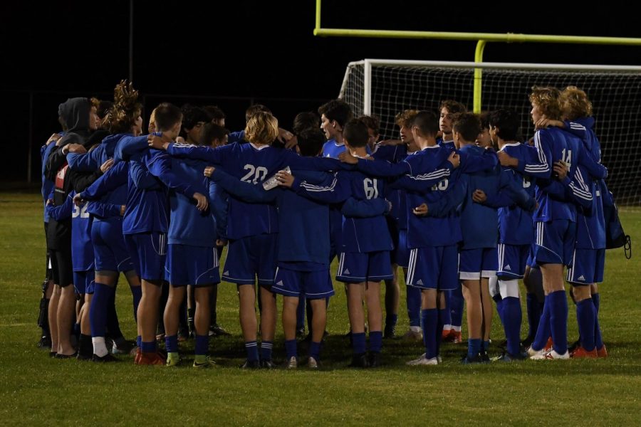 The team huddles during the 2019-2020 season.