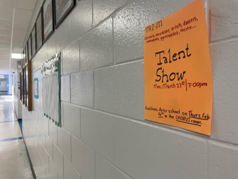 Talent Show poster hung up in the hallway. 