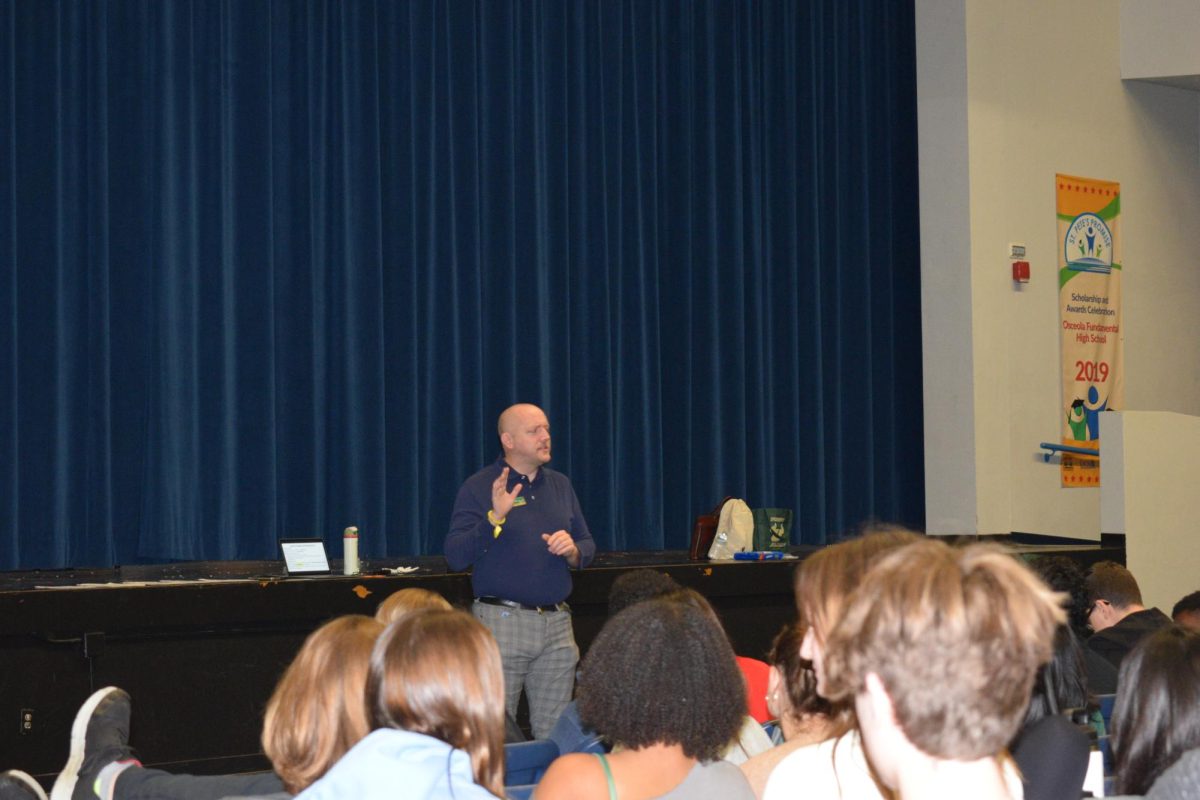 Professor Herron informing students about college.