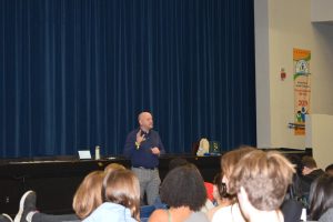  Professor Herron informing students about college.