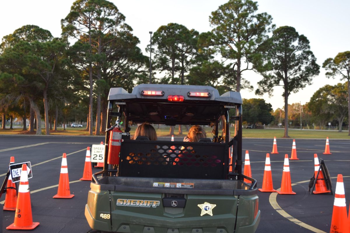 Students practice driving on the TRADD distraction course in front of the school on November 7th. 