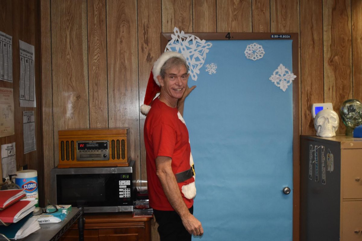 Mr. Pile shows off his outfit for Polar Express Day.