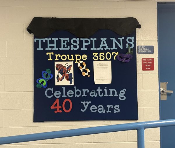 The Thespian Troupe 3507 board outside the auditorium. 