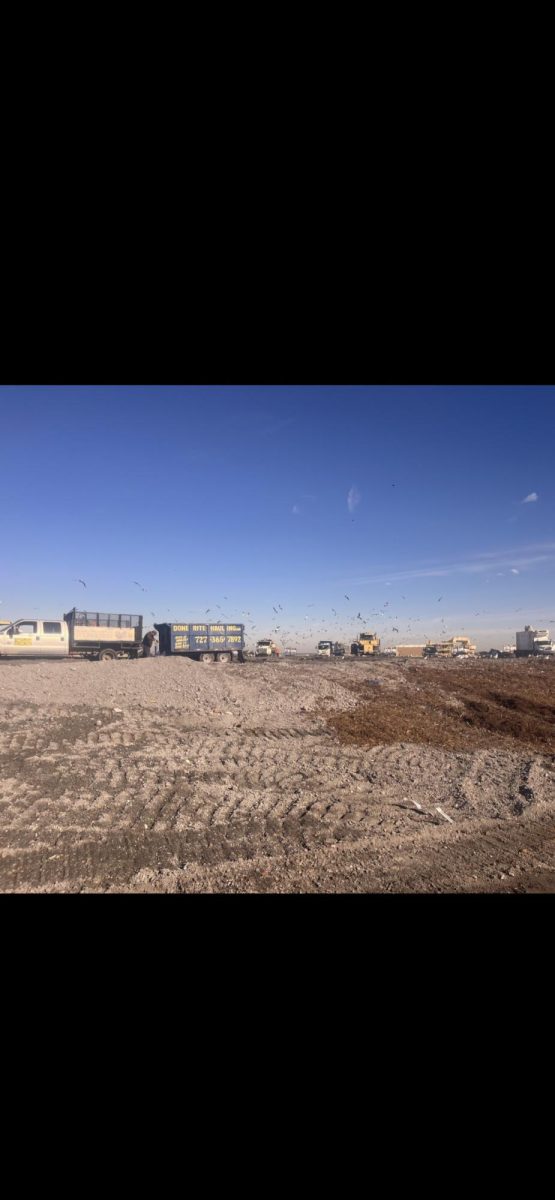 The school bus drove to the top of the ash landfill. It was about 120 feet tall.  