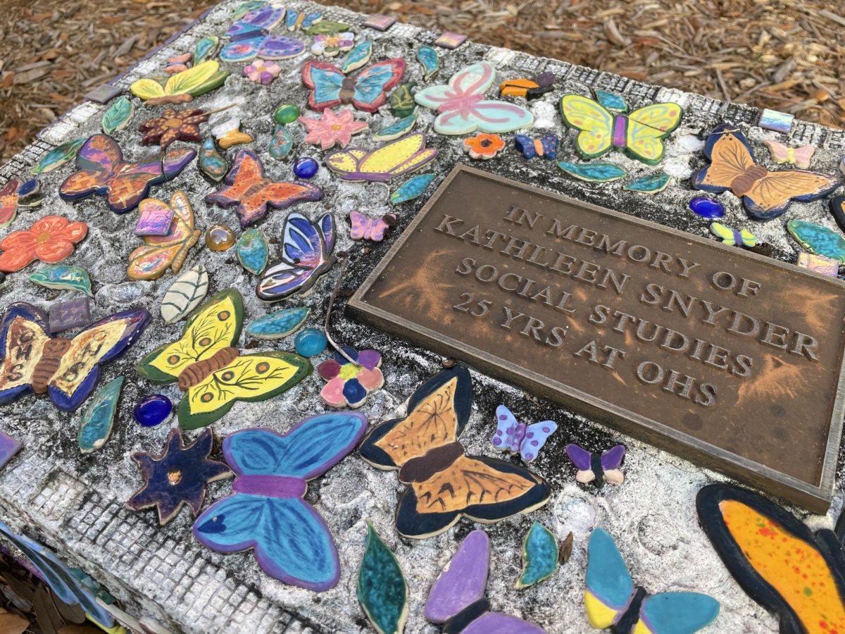 A bench dedicated to Kathleen Snyder in the Rose Garden at Osceola. 