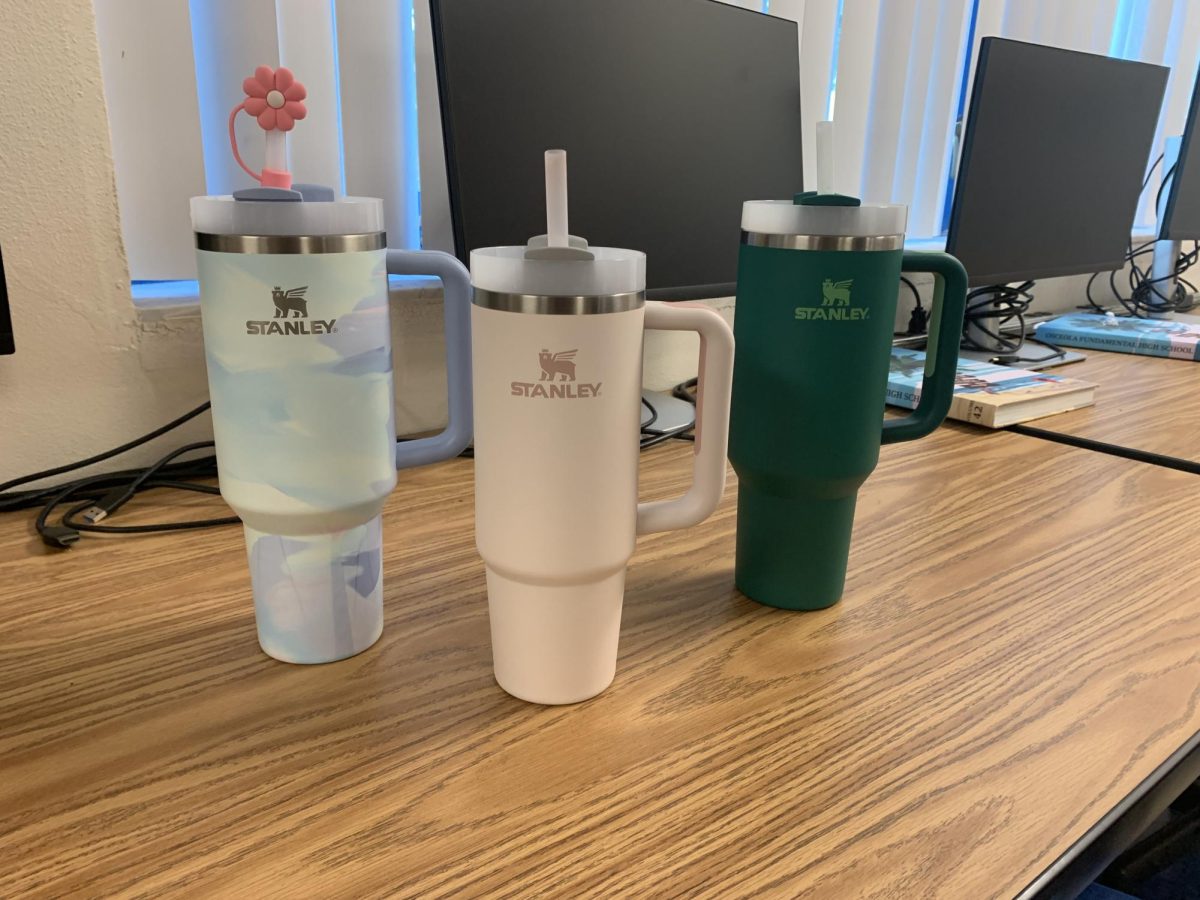 Students display their Stanley water bottles that they use throughout the day.