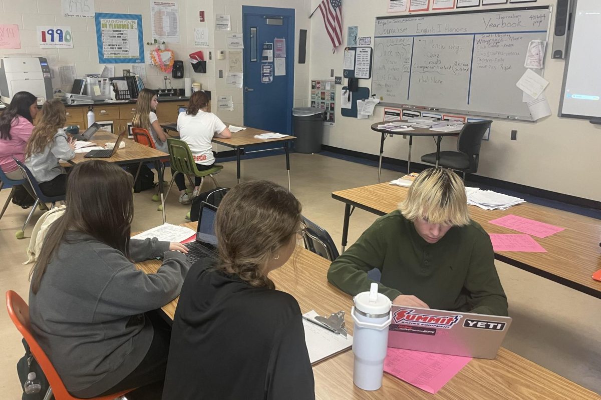 Student journalists interview each other in journalism class, period 3. 