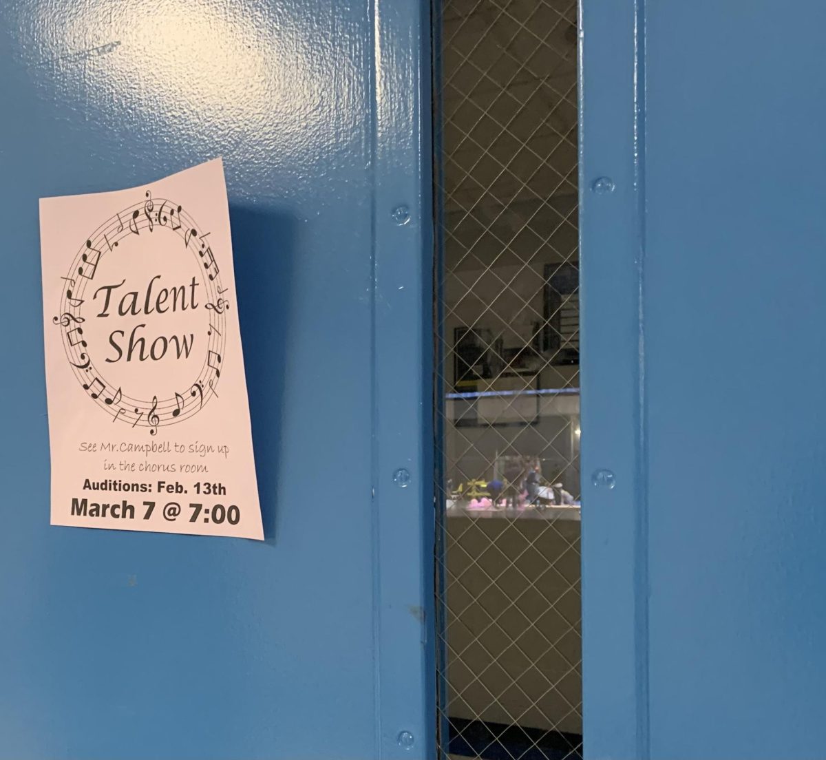 The Chorus door, stuck to it is the flyer to audition for the talent show. 