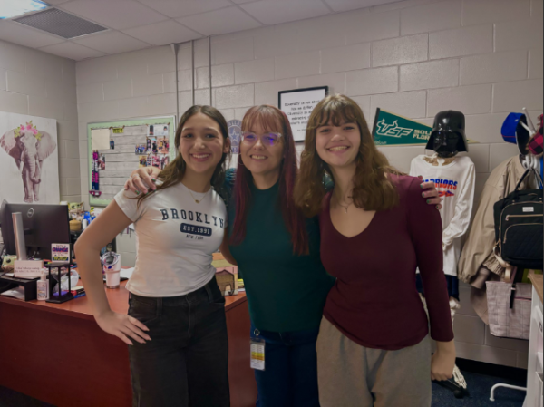 Mrs. Finley and two female web editors of journalism take a pic to represent women in administration. 