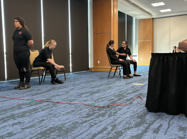 Victorya Natalino (far right), Sam Cressman, Kate Murphy, and Maryane Santos (far left) perform the student -directed scene at the 2025 Florida Senior Thespian State Festival.